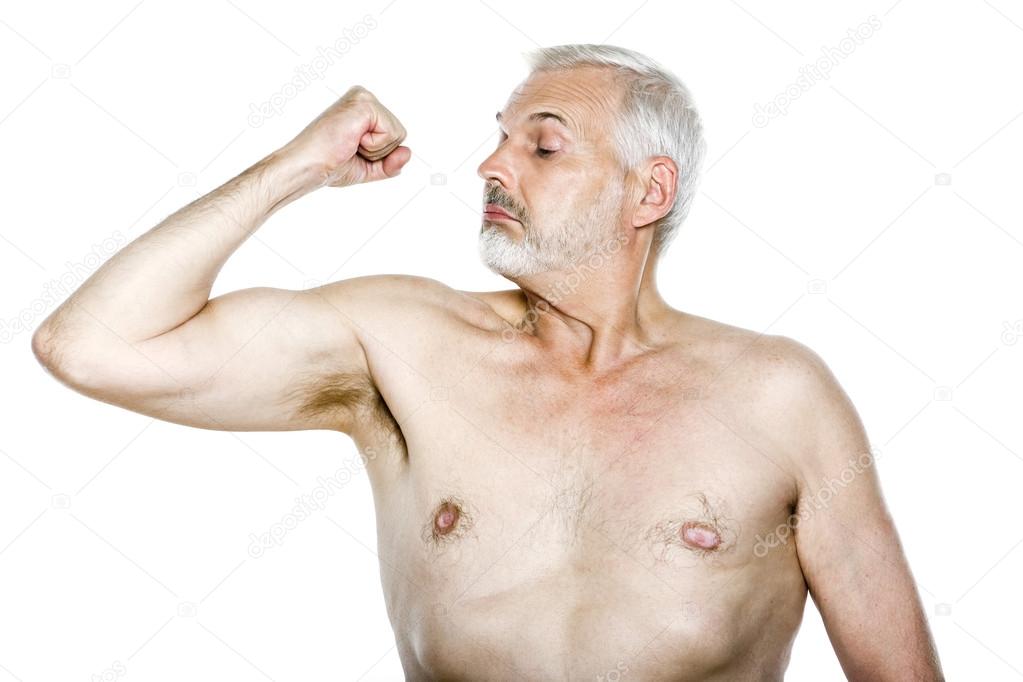 Senior man portrait showing biceps