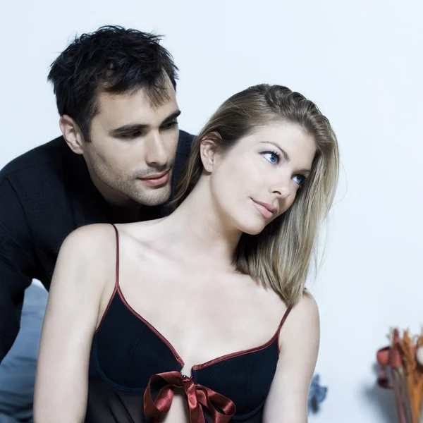 Young couple in a bed — Stock Photo, Image