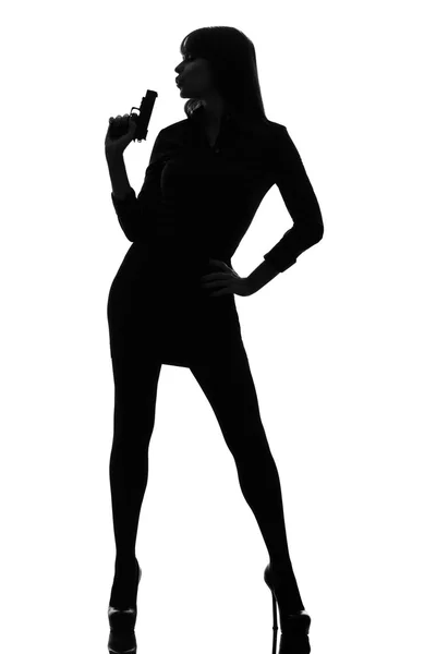 Sexy detective donna tenendo mirare pistola silhouette — Foto Stock