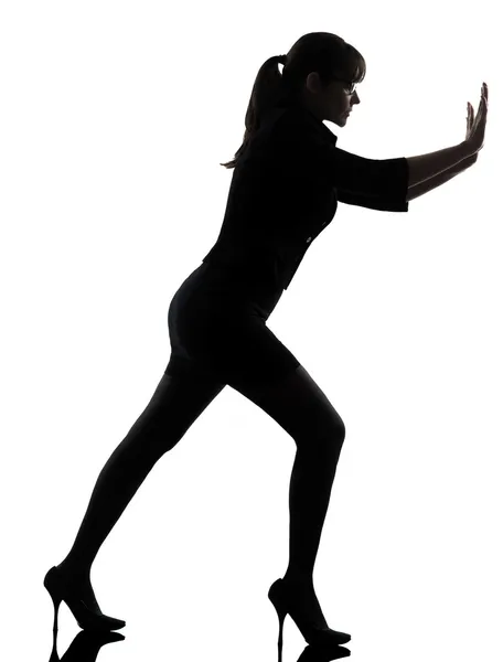 Business woman pushing silhouette — Stock Photo, Image