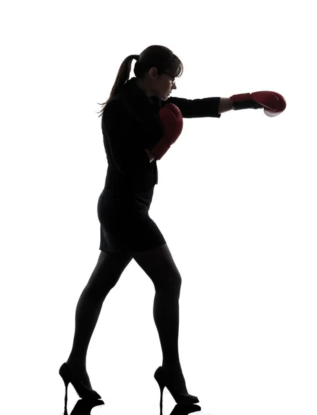 Business woman punching boxing gloves silhouette — Stock Photo, Image