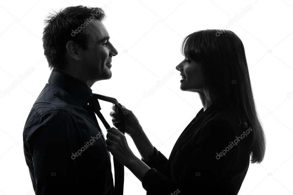 Couple woman helping man tying silhouette
