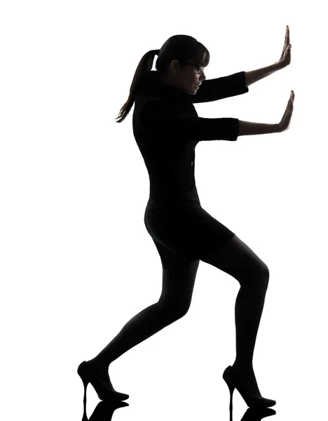 Business woman pushing silhouette — Stock Photo, Image