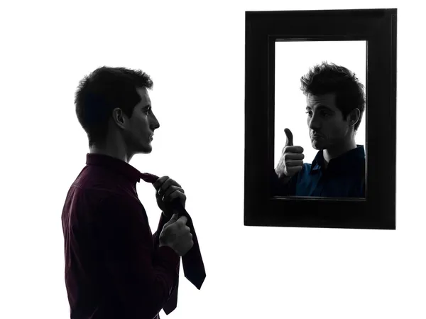 Man in front of his mirror dressing up silhouette — Stock Photo, Image