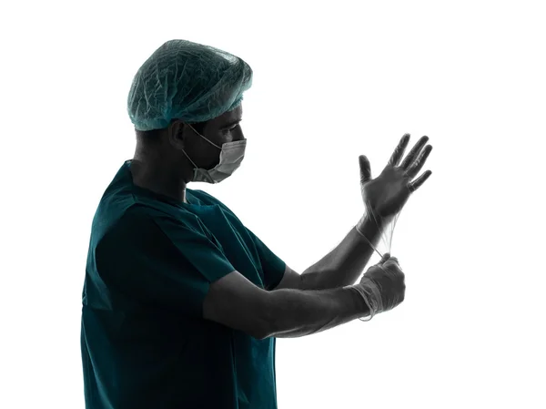 Médecin chirurgien homme portrait avec masque visage latex gants silhouette — Photo