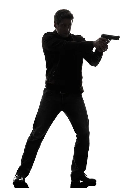 Man killer policeman aiming gun standing silhouette — Stock Photo, Image