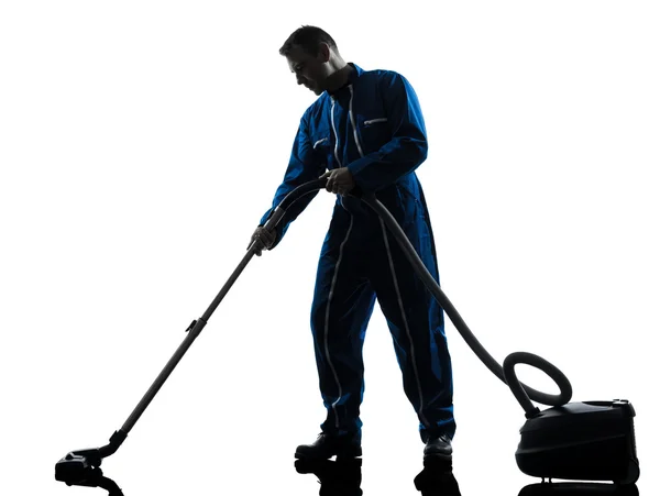 Man janitor vaccum cleaner cleaning silhouette — Stock Photo, Image