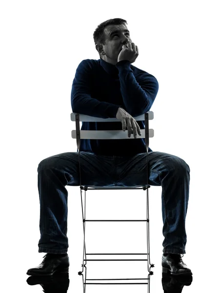 Man sitting thinking pensive silhouette full length — Stock Photo, Image