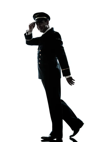 Homme en ligne pilote uniforme silhouette marche — Photo