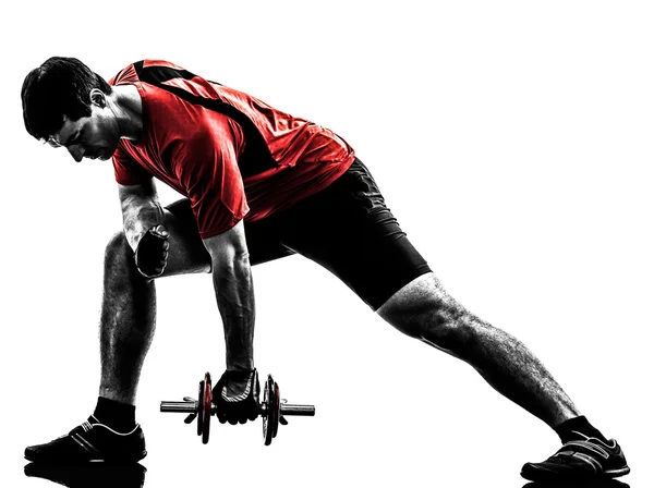 Hombre ejercitando silueta de entrenamiento con pesas —  Fotos de Stock