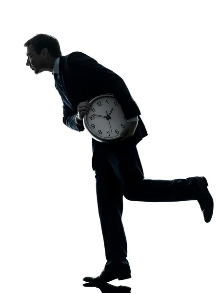 Business man holding clock robbing time silhouette — Stock Photo, Image