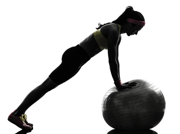 Woman exercising fitness workout push ups silhouette Royalty Free Stock Photos