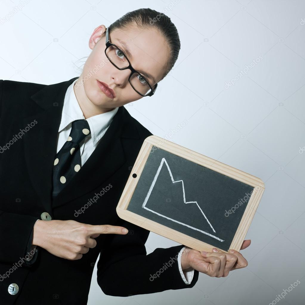 Serious business woman holding graphic board with deacreasing cu