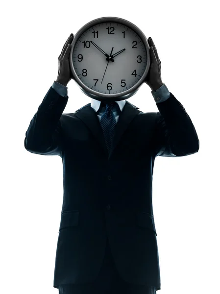 Hombre de negocios sosteniendo silueta de reloj — Foto de Stock