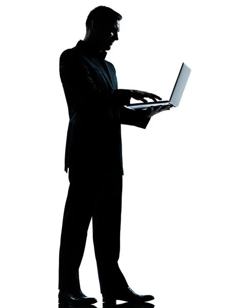 One business man silhouette computing computer laptop — Stock Photo, Image