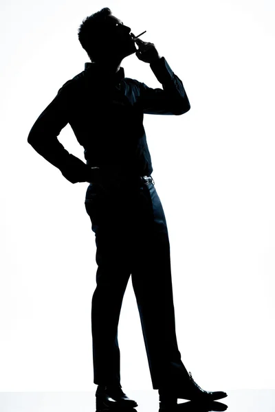 Silhouette man full length smoking cigarette — Stock Photo, Image
