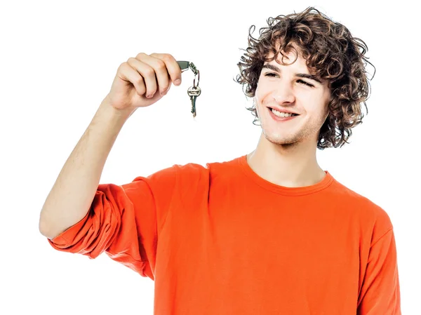 Молодий чоловік тримає портрет ключів — стокове фото