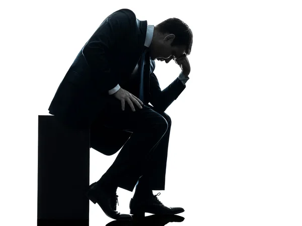 Sad business man sitting pensive silhouette — Stock Photo, Image