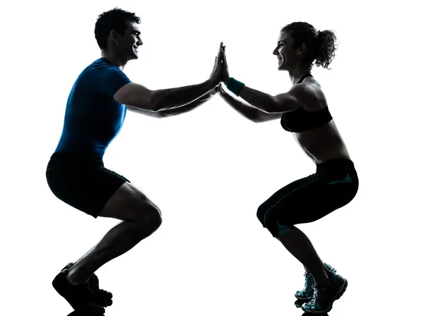 Homem mulher exercitando agachamentos treino fitness Fotos De Bancos De Imagens