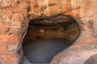 rocks caves in nabatean city of petra jordan clipart