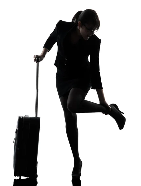 Business woman traveling massaging feet silhouette — Stock Photo, Image