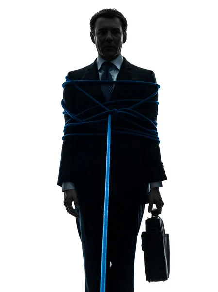 Homem de negócios amarrado prisioneiro silhueta — Fotografia de Stock