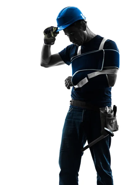 Injured manual worker man with injury brace despair silhouette — Stock Photo, Image