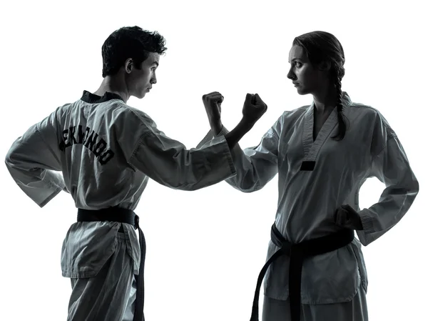 Karate taekwondo martial arts man woman couple silhouette — Stock Photo, Image