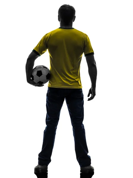 Задний вид сзади человек держа футбольный силуэт — стоковое фото
