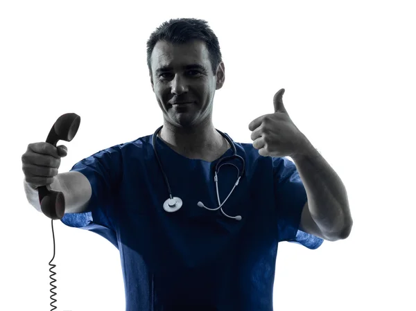 Doctor man silhouette holding phone thumb up gesture — Stock Photo, Image