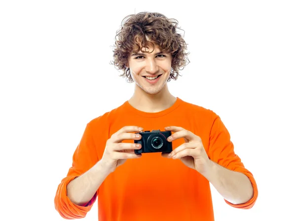 Young man photographer holding camera portrait — Stock fotografie