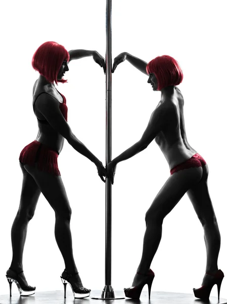 Due donne pole dancer silhouette — Foto Stock