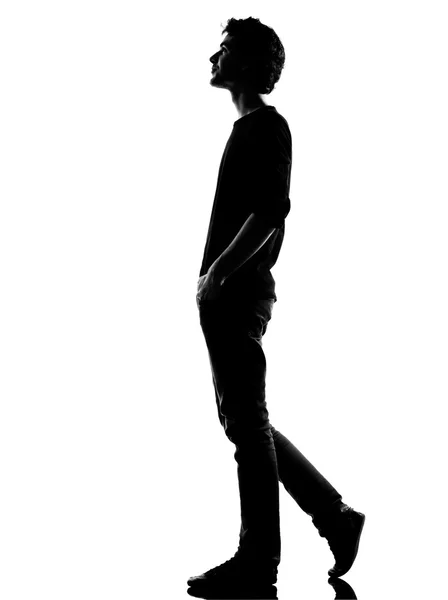 Young man silhouette walking happy smiling — Stock Photo, Image