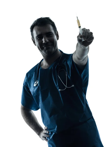Médico homem segurando seringa hipodérmica silhueta retrato Fotos De Bancos De Imagens Sem Royalties