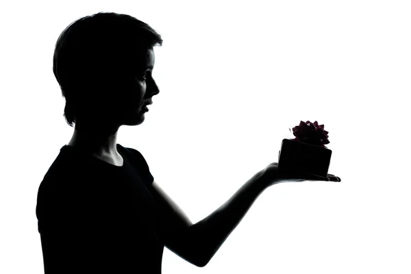 One young teenager boy or girl offering present gift silhouette — Stock Photo, Image