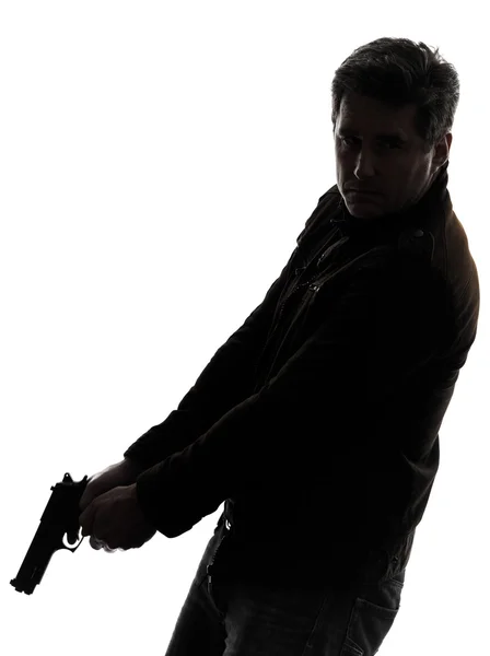Человек-убийца полицейский держит оружейный силуэт — стоковое фото