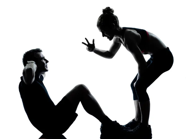 Um casal homem mulher exercitando aptidão treino Imagens De Bancos De Imagens