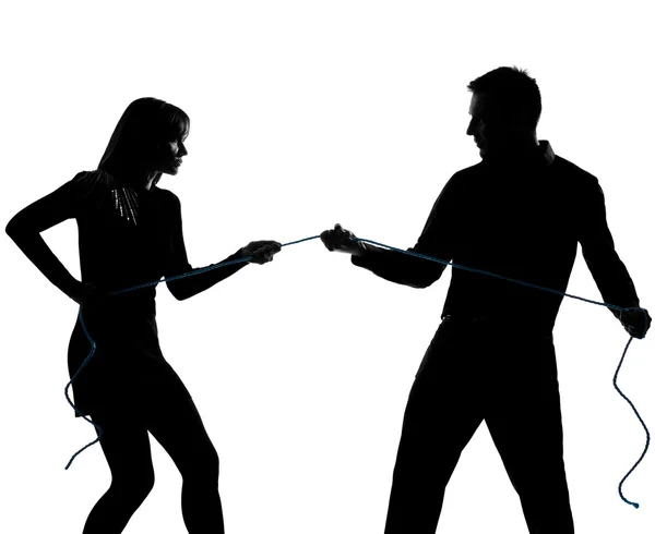 One couple man and woman pulling a rope — Stock Photo, Image