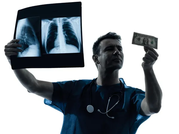 Doctor surgeon man examing dollar bill silhouette — Stock Photo, Image