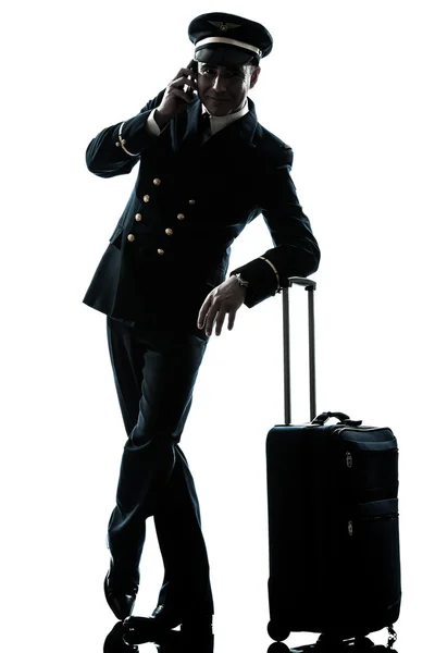 Man in airline pilot uniform silhouette — Stock Photo, Image