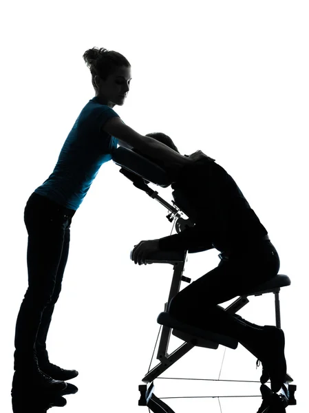 Massageterapi med stol silhuett — Stockfoto