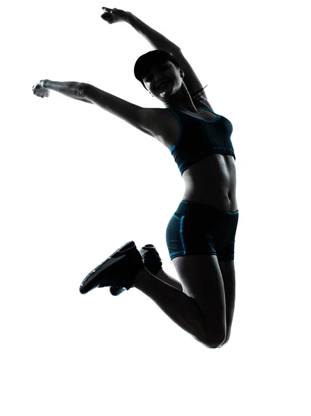 Woman runner jogger jumping happy silhouette — Stock Photo, Image