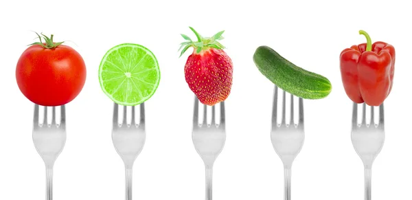 Obst und Gemüse auf Gabeln lizenzfreie Stockfotos