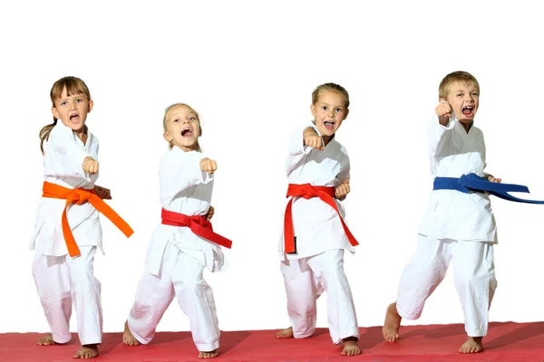 Four children in kimono hit a punch — Stock Photo, Image