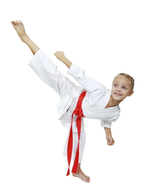 Girl in white kimono beats kicking isolated background — Stock Photo, Image