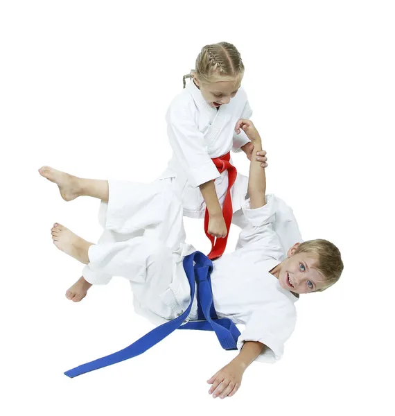 Girl in a kimono throws the boy in a kimono isolated — Stock Photo, Image