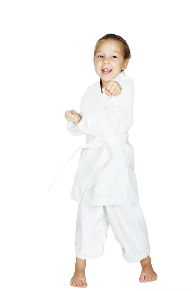 On a white background little girl beat a punch arm — Stock Photo, Image