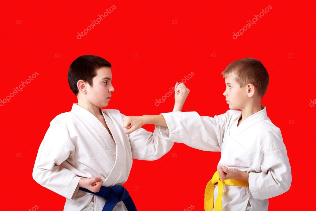 Sports paired exercises karate athletes perform in a kimono