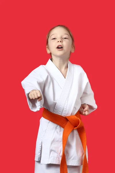 Little athlete is beating a punch in the average level — Stock Photo, Image