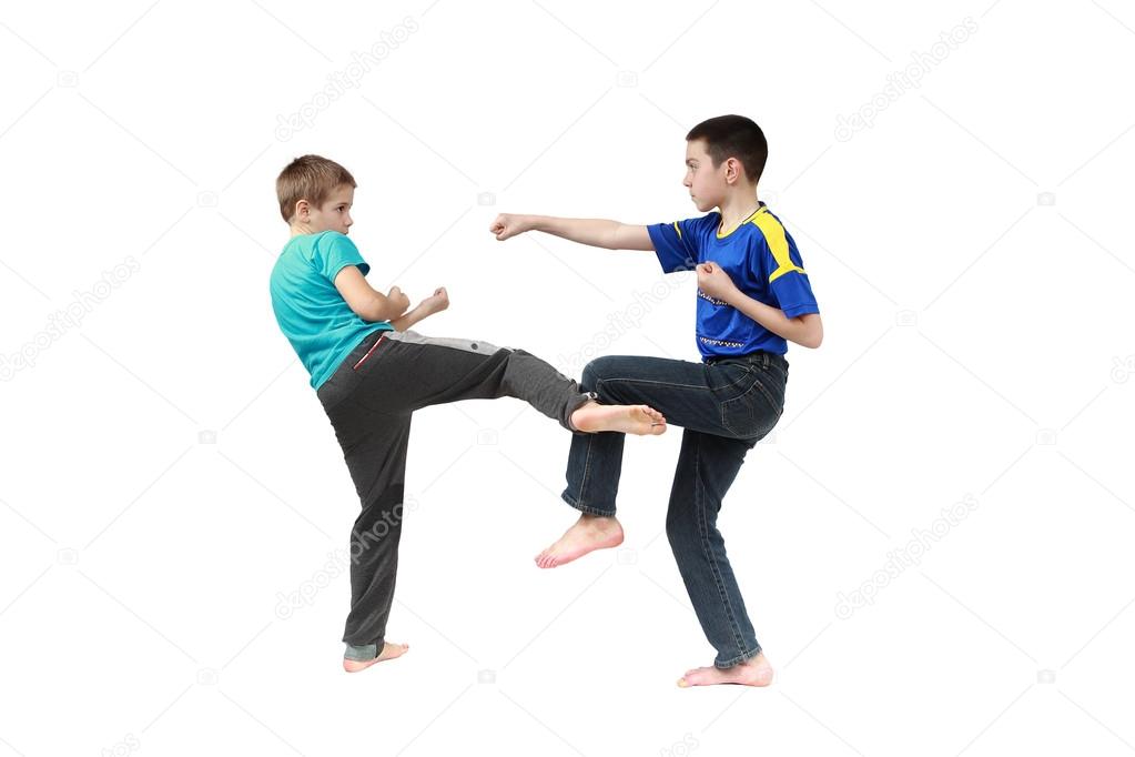 In sportswear clothing two boys are training techniques